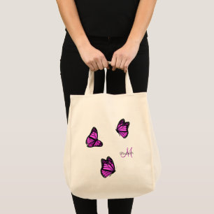 rosa lila butterflugor som vilar på en brygga tygkasse