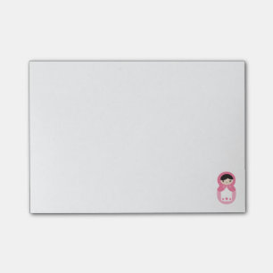 Rosa Matryoshka docka som Posta-det noterar Post-it Block