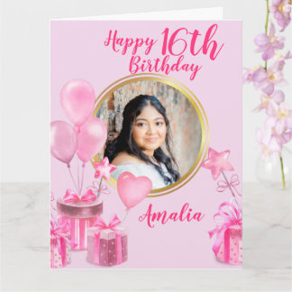 Rosa med presenter och ballonger runt foto kort