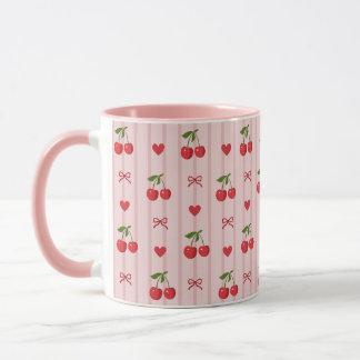 Rosa mugg med röda körsbär och röda slingor och hj