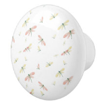 Rosa och Gult Dragonflies på vit keramisk knopp