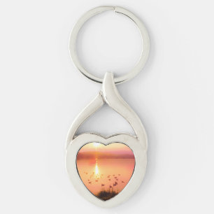 Rosa och persiko-sjö-solnedgång twisted heart silverfärgad nyckelring