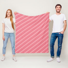 Rosa och röda julgodisrandiga karamellstavar  fleecefilt