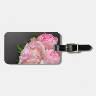 Rosa på mörkens bakgrund bagagebricka