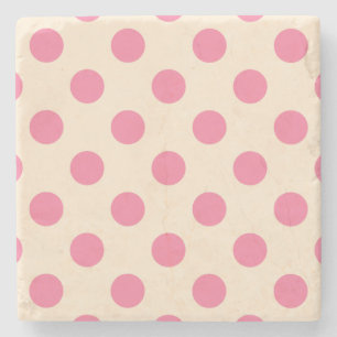 Rosa polka dots på grädde stenunderlägg
