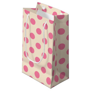 Rosa polka dots på gräddpåse med liten presentväsk