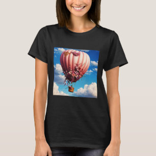 Rosa ros dekorerad tennluftballong som flödar in t shirt