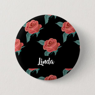 Rosa ros på svart knapp
