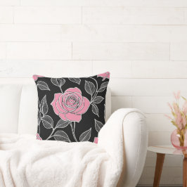 Rosa ros på svart kudde