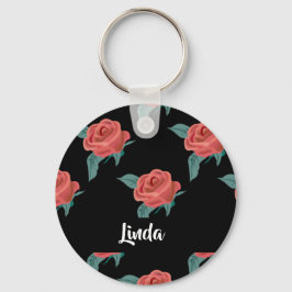 Rosa ros på svart nyckelring