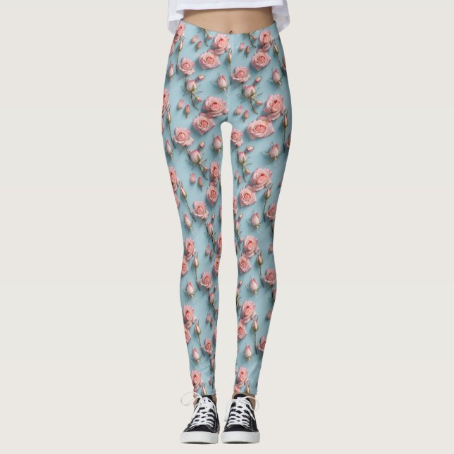 Rosa rosor utspridda över ljusblå bakgrund leggings (Framsida)
