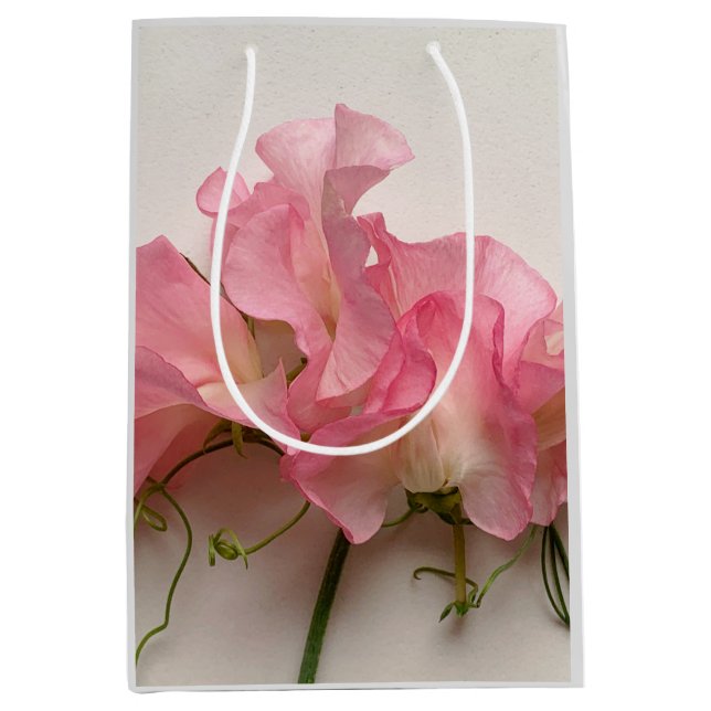 Rosa söta ärter nära varandra (Framsidan)