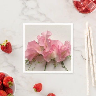 Rosa söta ärter nära varandra pappersservett