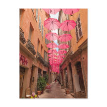 Rosa Umbrellas i Grasse Fransk Riviera i Frankrike