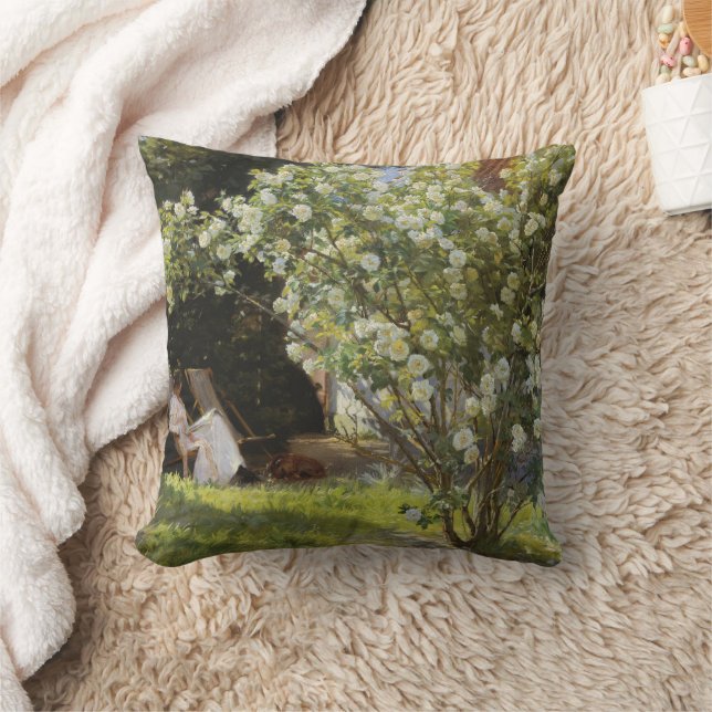 Roses. Marie Krøyer seated in the deckchair Kudde (Filt)