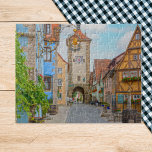 Rothenburg ob der Tauber Medieval Town Scenia Pussel<br><div class="desc">Gå in i en sagovärld med detta exquisita pussel med Rothenburg ob der Tauber, Tysklant. Den medeltida staden i picturesque är känd för sina charmerande halvtidstäckta hus, smala kullerstensgator och romantisk atmosfär, som alla fångas in i häpnadsväckande detalj i detta fotografi på morgonen. Föreställ er att ni vandrar genom hjärtat...</div>