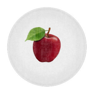 Rött äpple på vit skärbräda