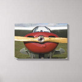 Rött flygplan och träpropeller canvastryck
