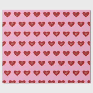 Rött hjärta på rosa bakgrund Presentpapper kärlek