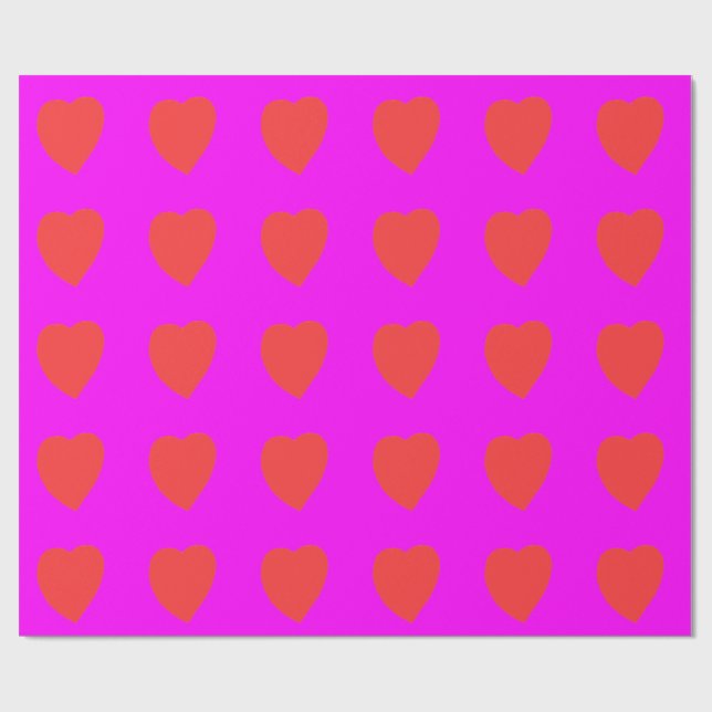 Rött hjärta på rosa magenta presentpapper (Platt)