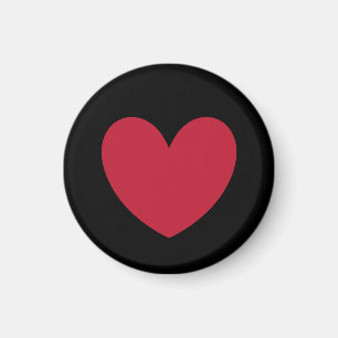 Rött hjärta på svart magnet
