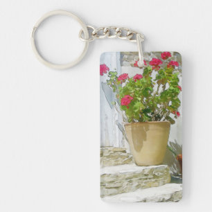 Rött vattenfärgat geranium nyckelring
