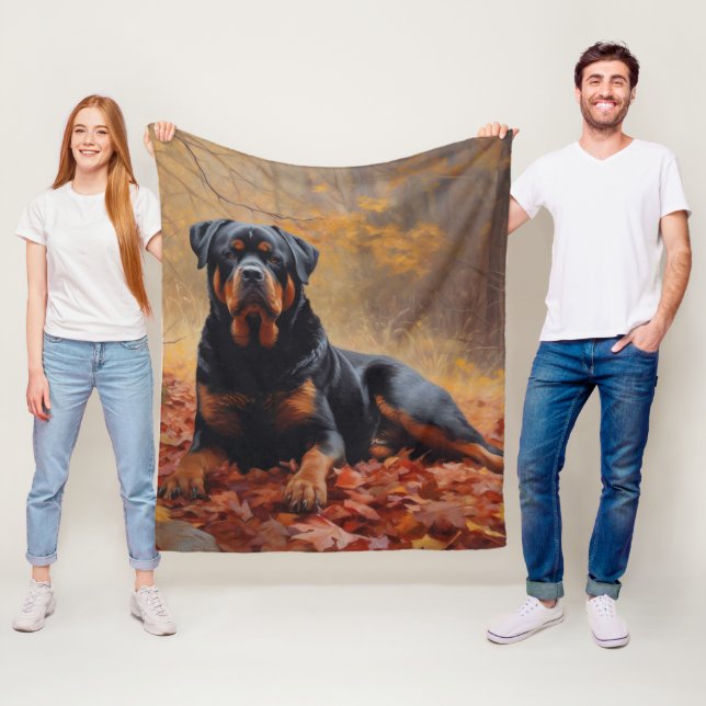 Rottweiler bland fallna höstlöv Inspirerar Fleecefilt (På plats)
