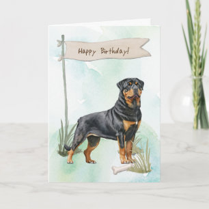 Rottweiler Hund aveln utomhus under födelsedagssky Kort