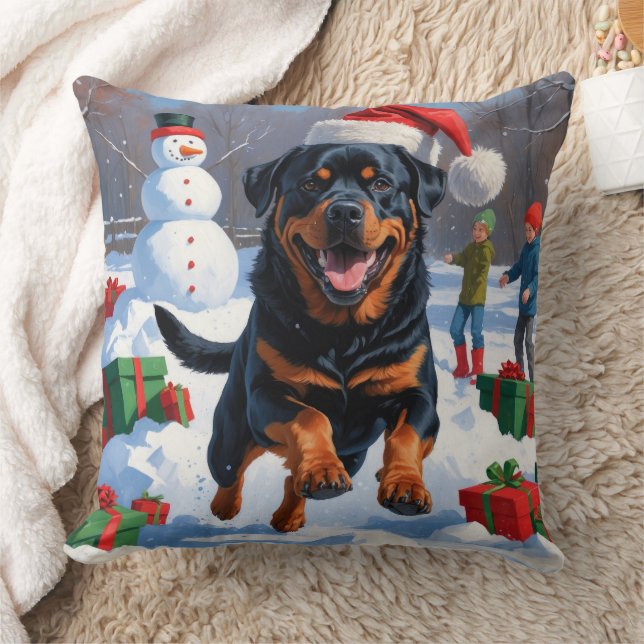Rottweiler springer i snö med julhatt kudde (Filt)