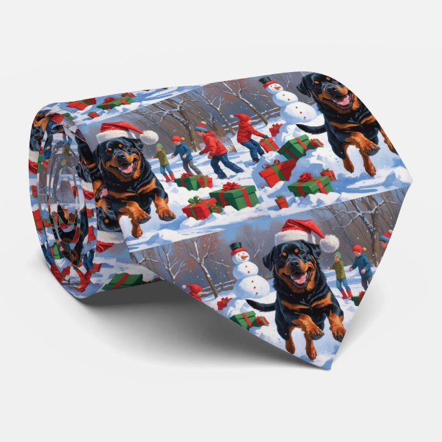 Rottweiler springer i snö med julhatt slips (Rullad)