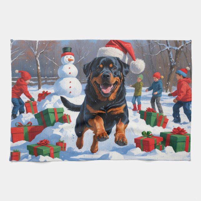Rottweiler springer i Snö med julklapp Kökshandduk (Horisontell)