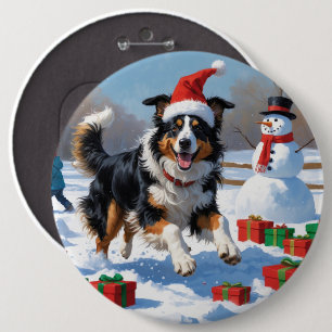 Rough Collie springer i snö med julhatt Knapp