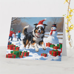 Rough Collie springer i snö med julhatt Kort