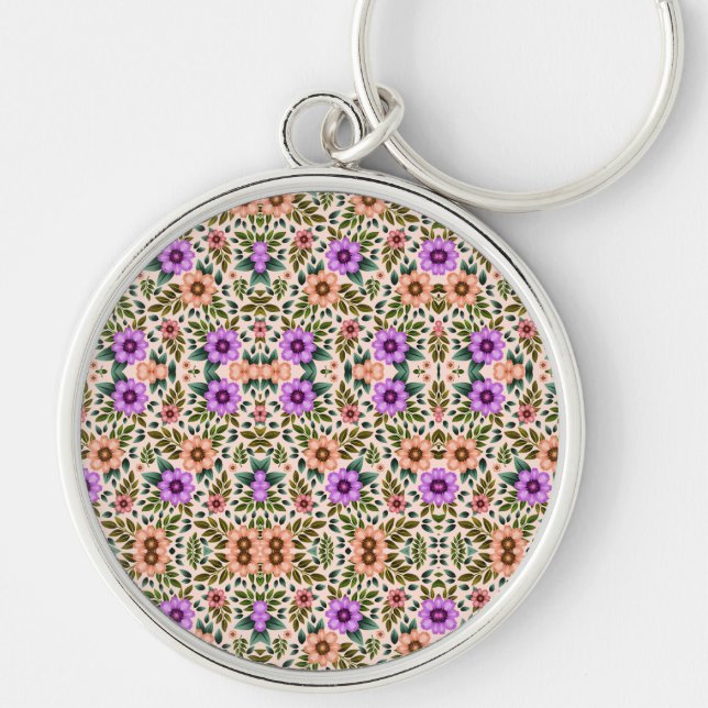 Round keychain featuring intricate floral patterns rund silverfärgad nyckelring (Framsidan)