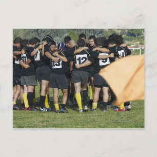 Rugby-team som står i en cirkel vykort