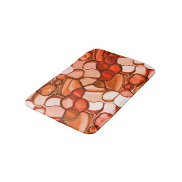 Rund nyven form såsom frön, koralltoner och rött badrumsmatta