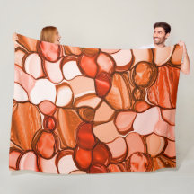 Runda ojämna former som frön, koralltoner och rött