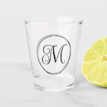 Runt lockigt skrivet monogram