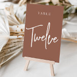 Rust Hand Scripted Bord TWELVE Bordsnummer<br><div class="desc">Enkla kort och kort för bordsnummer av chic i jordton, rosa och vita gör en elegant påstående vid bröllop eller vid händelsen. Designfunktionerna "bord [nummer]" i en ögonetsande blandning av klassisk serif och handskriven skriptskrift. Utformningen upprepas på båda sidor. Individuellt numrerade kort som säljs separat. Beställ varje bordsnummer var för...</div>