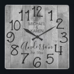 Rustic Barn Wood Farmhouse Custom Family Name Fyrkantig Klocka<br><div class="desc">A rustic, unique, one-of-a-kind personalized design features a faux wood background with and the words, "MICHAEL & KAREN Anderson est. 20XX" in black typography. Personalize this clock by adding your own personal information. Makes a great wedding, anniversary, or housewarming gift. Click "personalize this template" to change the names and fonts...</div>