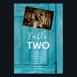 Rustic Blue Wood 2 Foton Bröllop Guest Namn Bordsnummer<br><div class="desc">Den här designen har en blå, rustik träbakgrund med ett urval av dina personliga pars foton. Bakgrunden till det roliga blå träet kompletteras av den vita texten och ett personligt foto på ena sidan och ett annat personligt foto på den andra sidan. Träets blå toner skapar en gedigen nautisk känsla....</div>