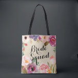 Rustic Boho Watercolor Flowers Bride Squad Tygkasse<br><div class="desc">Vackra, rustiska vattenfärgblommor fungerar som en boho ram för ord "Bride Squad" på den här brudens sida-toten som ger en underbar gåva till dina brudtärnor. Anpassa med ditt brudgumms namn längst bak. Modern kalligrafi lägger till en trendig i snyggten till den här klassiska designen från Kattunge Paj Prints. Du kan...</div>