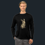 Rustic Rabbit T Shirt<br><div class="desc">Embrace the charm of the countryside with this beautifully detailed sketch of a bunny enjoying a carrot. With a vintage,  hand-drawn aesthetic and soft sepia tones,  this design brings a touch of rustic warmth to your wardrobe. Perfect for gardeners,  nature lovers,  or anyone who appreciates classic animal illustrations.</div>