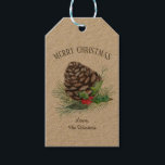 Rustic Winter Forest Gräs Cone Holly Kraft Helgdag Presentetikett<br><div class="desc">Naturinspirerade,  pappra helgdag i Kraft med en vinterskog i gräs,  gräs boughs,  röda hollbär och grönt löv. Anpassa enkelt hälsning (visas med "God jul") och ditt namn.</div>