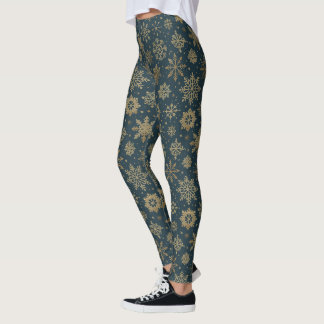 Rustika guld snöflingor på mörkgrön leggings