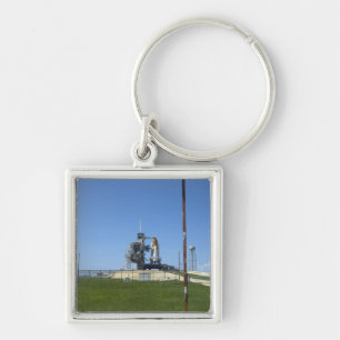 Rymdfärjasträvan inramas av en windsock fyrkantig silverfärgad nyckelring