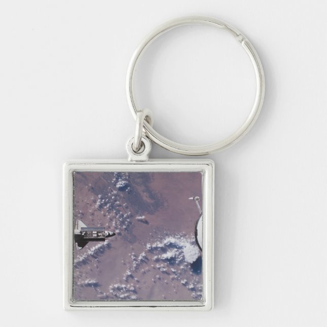 Rymdpendelns ände 20 fyrkantig silverfärgad nyckelring (Framsidan)