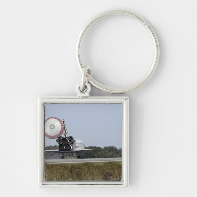 Rymdskytteln Atlantis upprullar sin dragkedja 3 Fyrkantig Silverfärgad Nyckelring (Framsidan)