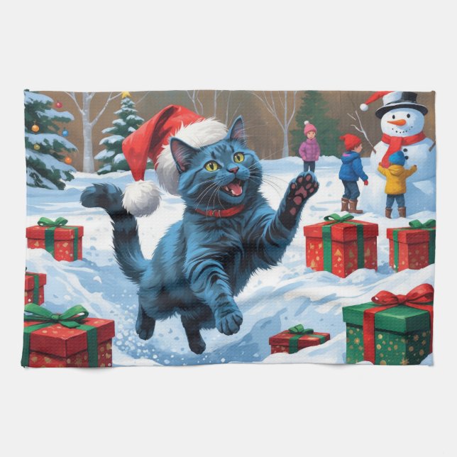 Rysk blå katt springer i snö med julhatt kökshandduk (Horisontell)