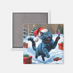 Rysk blå katt springer i snö med julhatt magnet